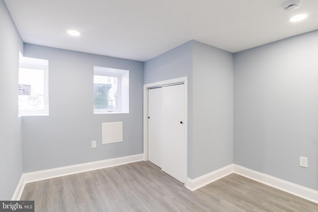 spare room featuring light wood-type flooring