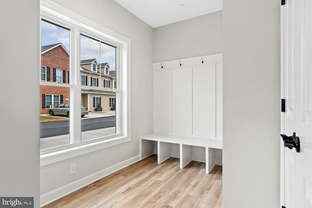 mudroom with light hardwood / wood-style floors