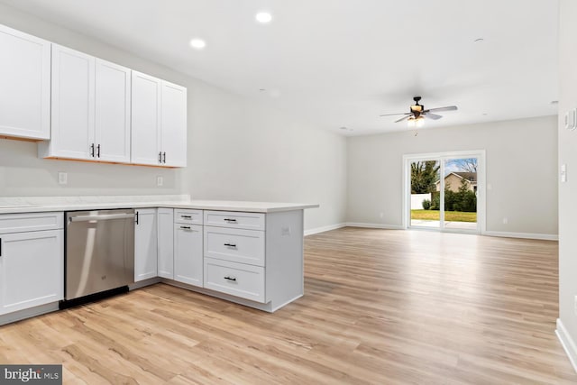 kitchen featuring stainless steel dishwasher, ceiling fan, light hardwood / wood-style floors, and white cabinets