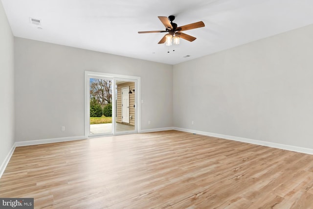 spare room featuring ceiling fan and light hardwood / wood-style floors