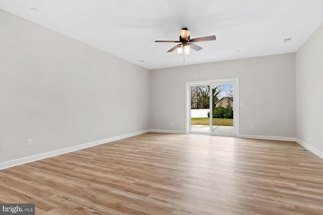 spare room featuring ceiling fan and light wood-type flooring