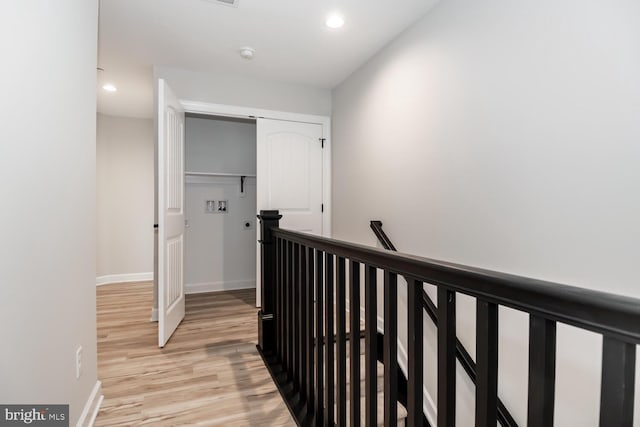 hall with light wood-type flooring