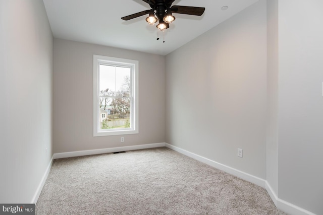 carpeted empty room with ceiling fan