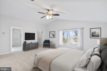 bedroom with ceiling fan, light colored carpet, and vaulted ceiling