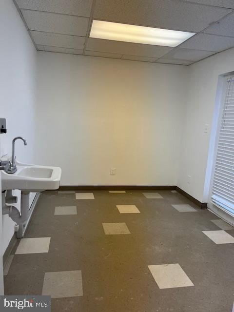 bathroom with a drop ceiling