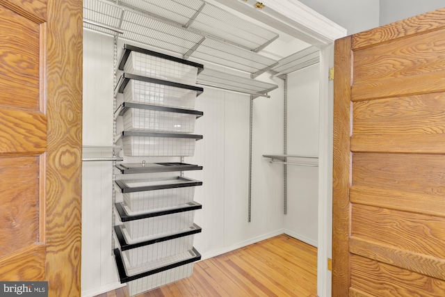 walk in closet featuring hardwood / wood-style flooring