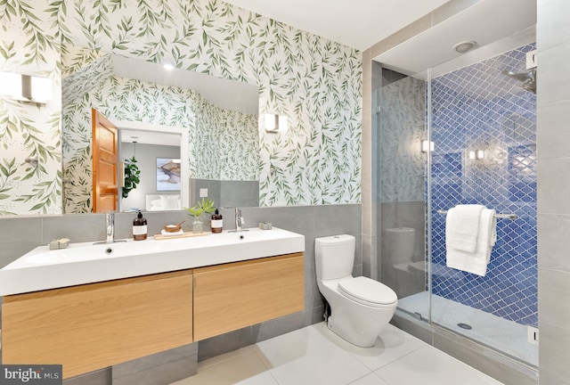 bathroom with vanity, toilet, an enclosed shower, and tile patterned flooring