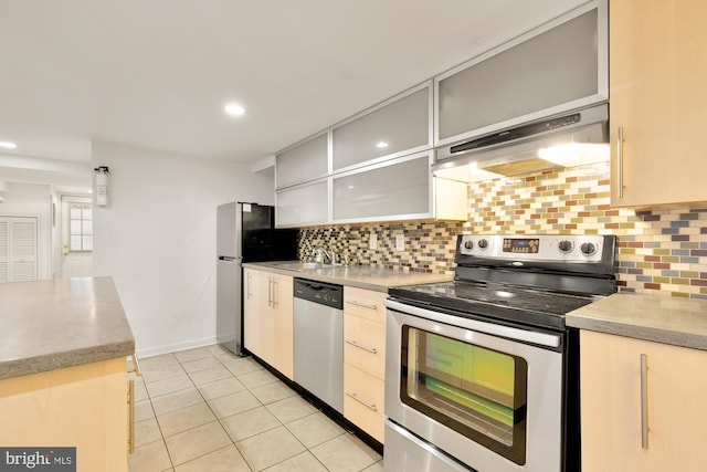 kitchen with extractor fan, stainless steel appliances, sink, backsplash, and light tile patterned flooring