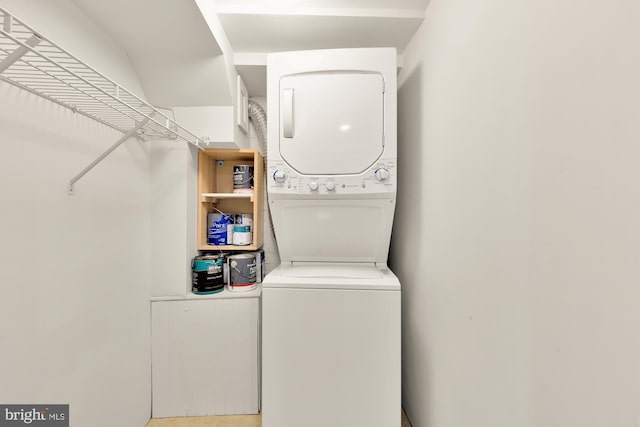 laundry area with stacked washer and dryer