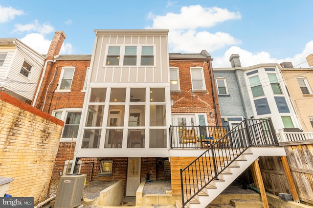 back of house featuring central AC unit