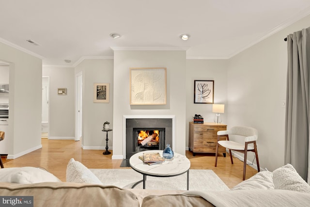 living room featuring light wood-type flooring and ornamental molding