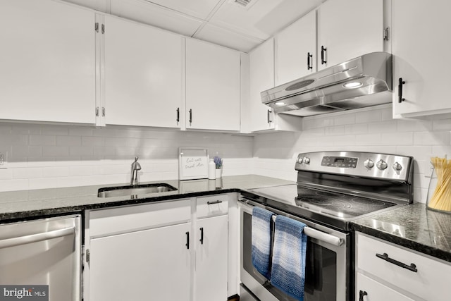 kitchen featuring stainless steel appliances, white cabinets, sink, and tasteful backsplash