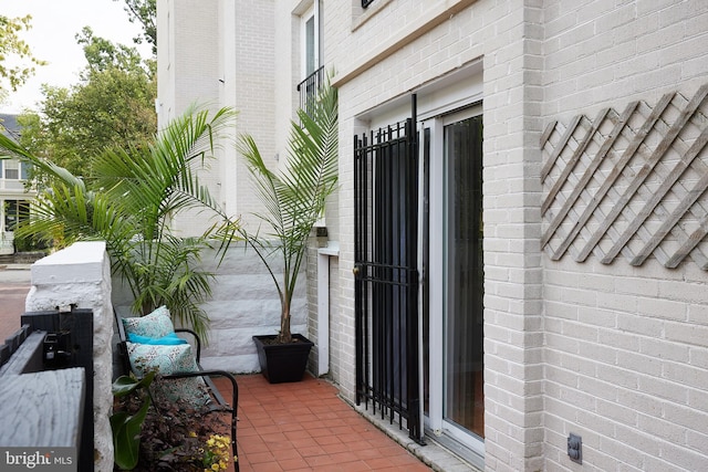 property entrance featuring a patio