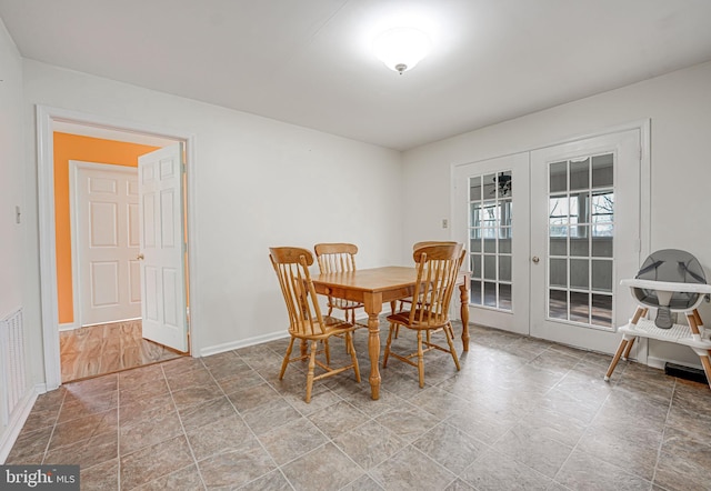 dining area featuring french doors