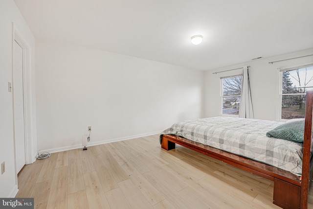 bedroom with light wood-type flooring