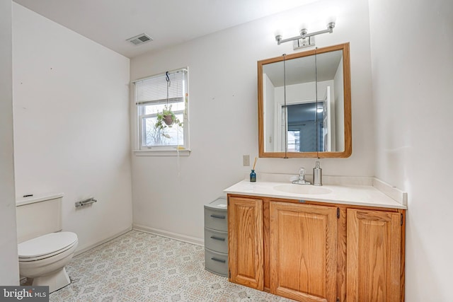 bathroom with vanity and toilet