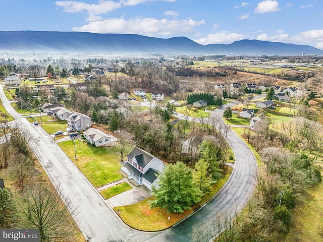 birds eye view of property with a mountain view