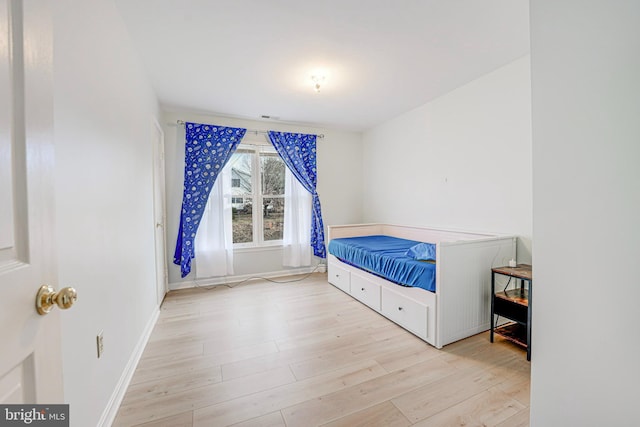 bedroom with light hardwood / wood-style flooring