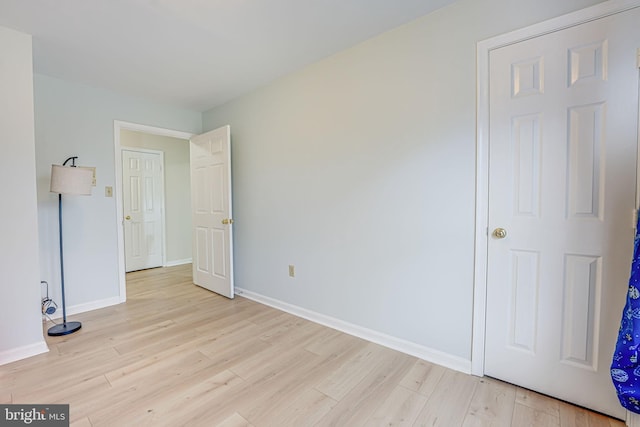 unfurnished bedroom with light hardwood / wood-style flooring