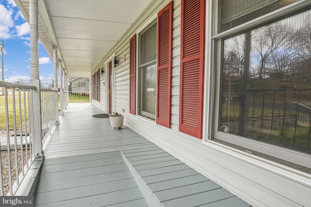 wooden terrace with a porch