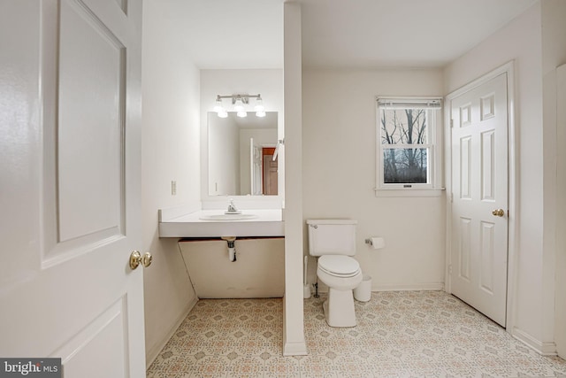 bathroom with toilet and sink