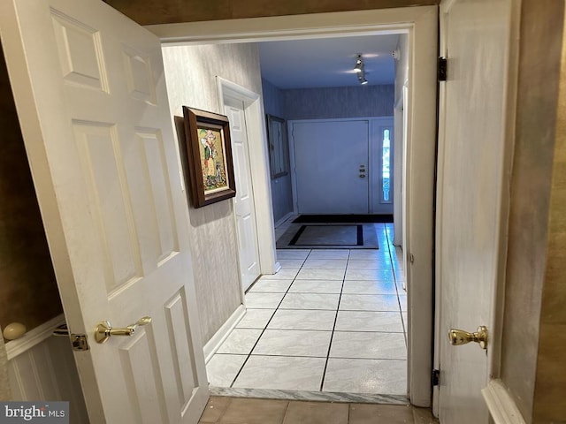 hallway featuring light tile patterned floors