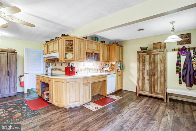 kitchen featuring white dishwasher, dark hardwood / wood-style floors, pendant lighting, and a textured ceiling