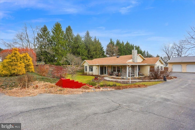 ranch-style house featuring a garage