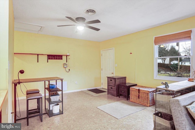 interior space with ceiling fan