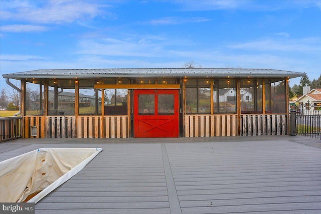 wooden terrace featuring a sunroom