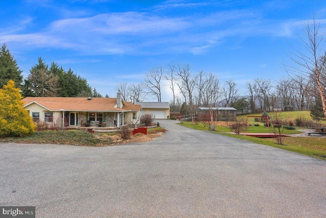 single story home with a garage