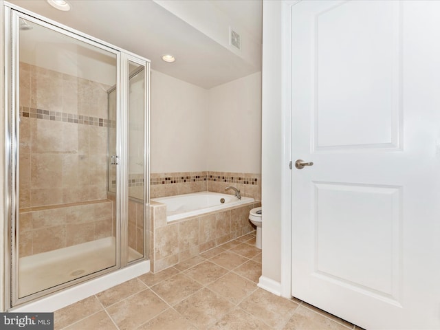 bathroom featuring separate shower and tub and tile patterned floors