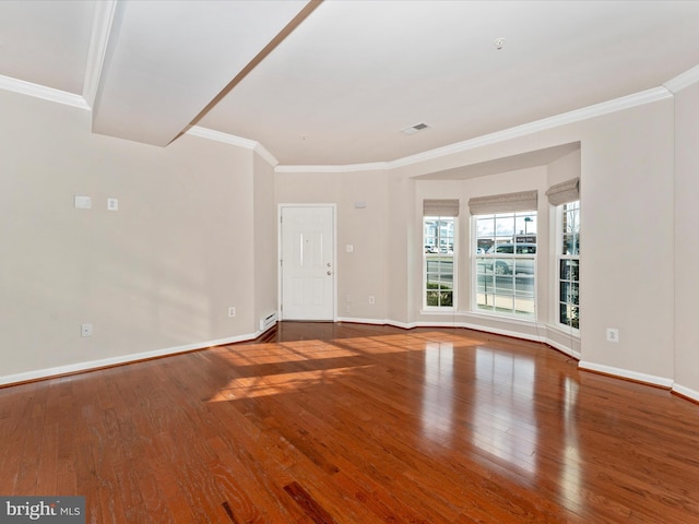 unfurnished room with wood-type flooring and ornamental molding