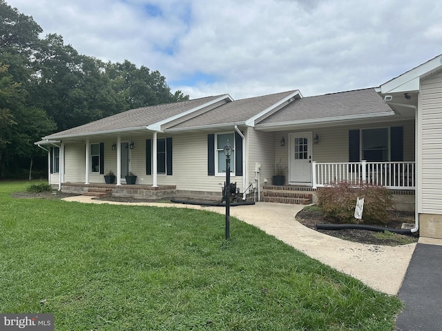 single story home featuring covered porch and a front lawn