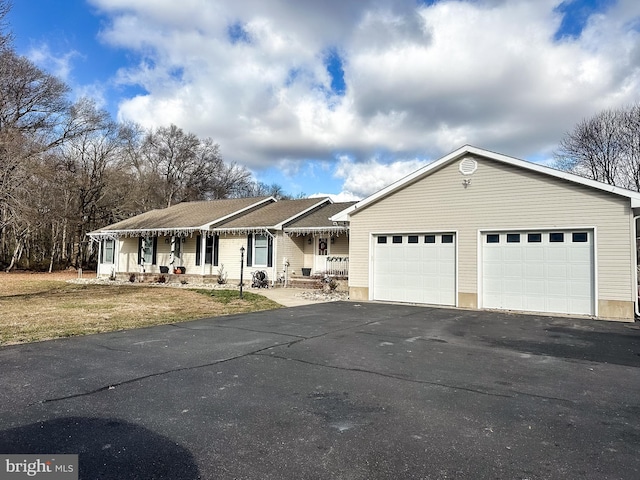 ranch-style house featuring a garage