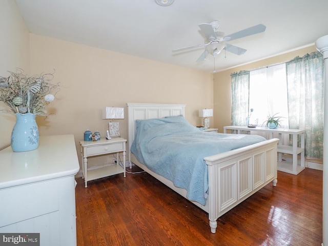 bedroom featuring dark wood-type flooring and ceiling fan