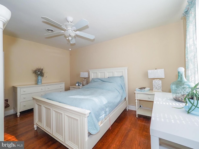 bedroom with dark wood-type flooring and ceiling fan