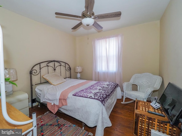 bedroom featuring dark wood-type flooring and ceiling fan