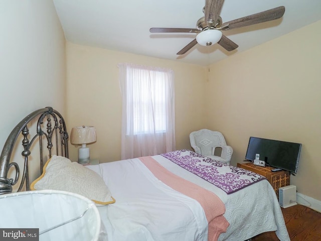 bedroom with wood-type flooring and ceiling fan