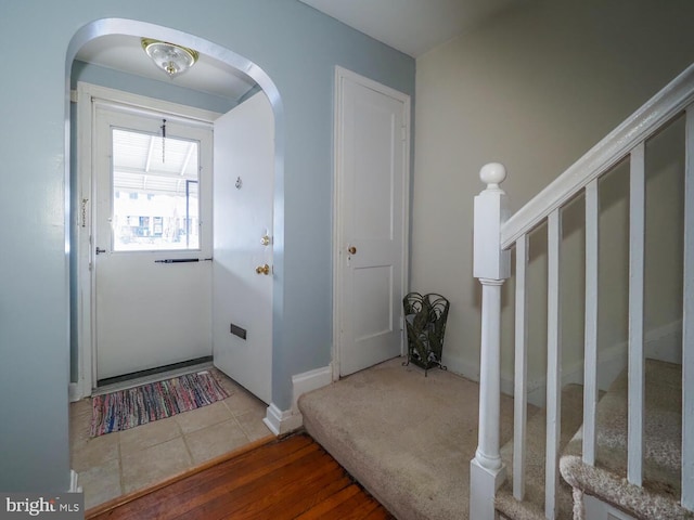 doorway with tile patterned flooring