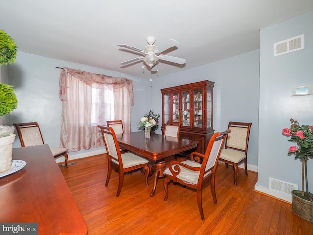 dining space featuring hardwood / wood-style floors and ceiling fan