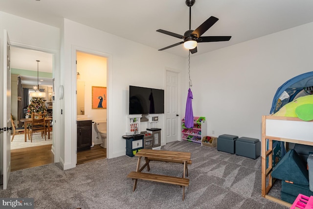 living room with ceiling fan and carpet floors