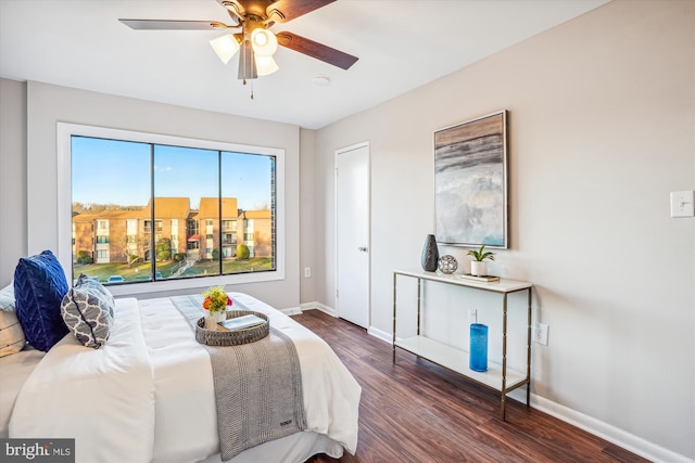 bedroom with ceiling fan and dark hardwood / wood-style flooring