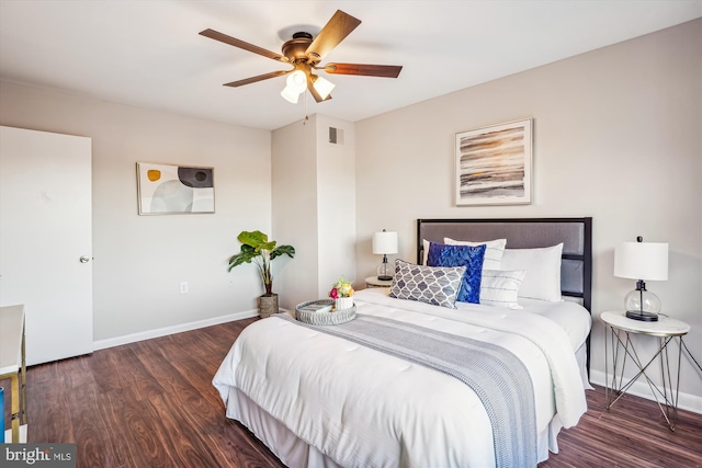 bedroom with ceiling fan and dark wood-type flooring