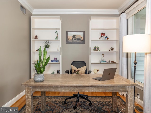 office space with hardwood / wood-style flooring and crown molding