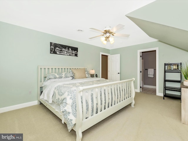 bedroom featuring ceiling fan, lofted ceiling, and light carpet