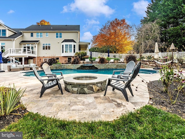 view of swimming pool with a patio area and an in ground hot tub