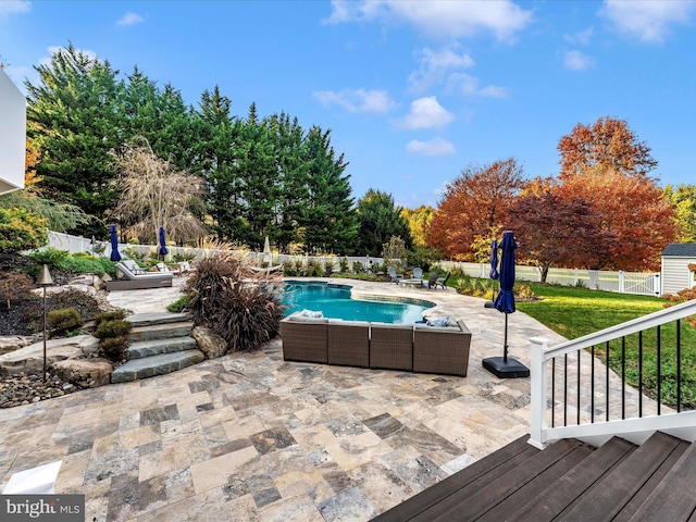 view of swimming pool featuring a lawn and a patio