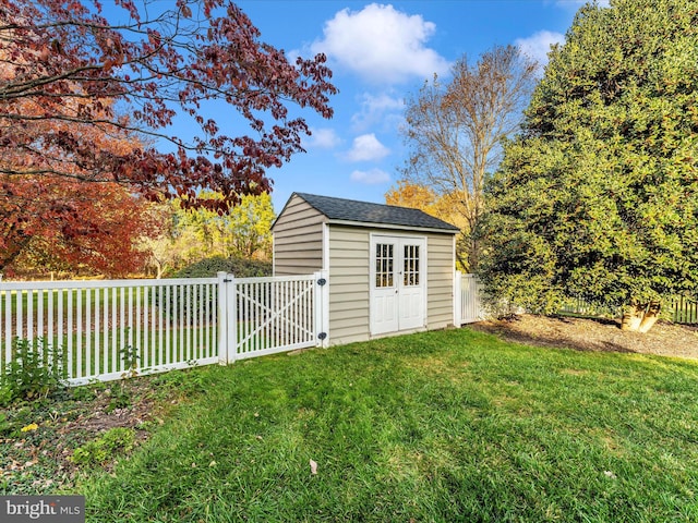 view of outbuilding with a lawn