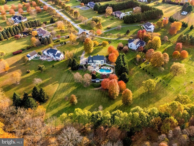 birds eye view of property with a rural view